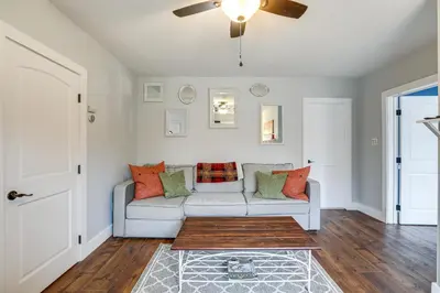 a living room with a couch and a ceiling fan at In-Town and Walkable Historic Yardley Retreat! in Yardley