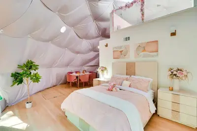 a bedroom with a tent with a bed and a table at Unique Escapes - Rosé All Day Geodome in Monticello