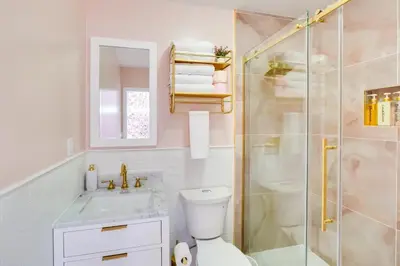 a bathroom with a shower and a toilet and a sink at Unique Escapes - Rosé All Day Geodome in Monticello
