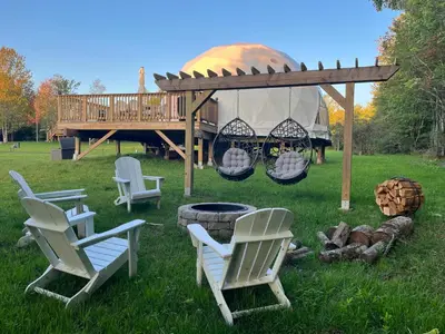 a gazebo with chairs and a fire pit at Unique Escapes - Rosé All Day Geodome in Monticello