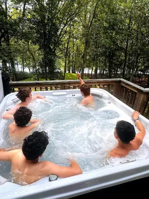 a group of people in a hot tub at Lakefront, Hot Tub, Heated Pool, Beach, Free Boats in Bushkill