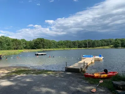 a group of people in the water at a lake at Lakefront, Game Rm, Arcade, Hot Tub, Pool, Pets in Bushkill