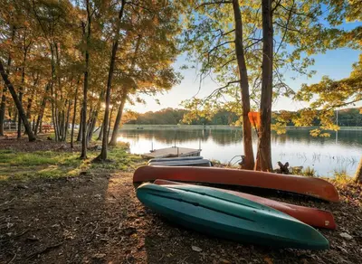 a group of boats parked on the shore of a lake at Lakefront, Game Rm, Arcade, Hot Tub, Pool, Pets in Bushkill