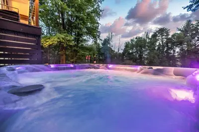 a hot tub with a fountain in a park at Modern Lodge on 6 acres - 15 mins to Camelback in Cresco