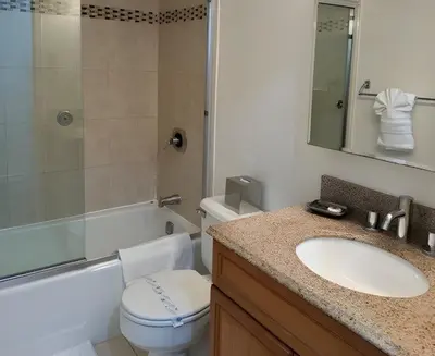 a bathroom with a sink and a toilet and a tub at PlanURstay - Spacious Midtown West Fully-Serviced - 1BR & 1BTH in New York