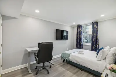 a bedroom with a bed and a desk and a chair at AF Stays - Philadelphia Callowhill in Philadelphia