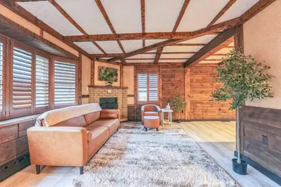 a living room with a couch and a fireplace at Luxury-Cabin Mount View *Gym*Game Room *Fire Place in Lehighton