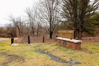 a sign in a field with a sign for a veterans park at Luxury-Cabin Mount View *Gym*Game Room *Fire Place in Lehighton