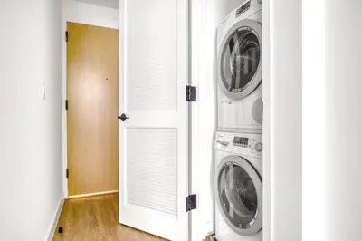 a laundry room with two washer and dryer at FiDi 2br w wd doorman elevator roof NYC-772 in New York