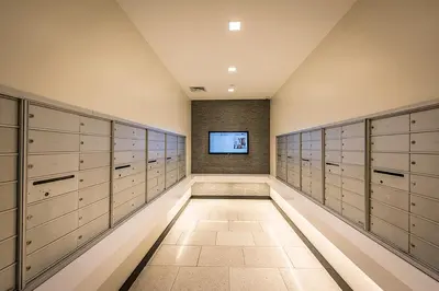 a large dressing room with lockers and a television at FiDi 2br w wd doorman elevator roof NYC-772 in New York