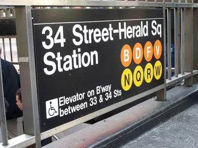 a sign for a street heated sat station at Nest Family Aparthotel - No Window in New York