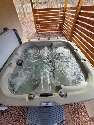 a jacuzziificialificialificialificialificialificialificialificialificialificialificial at Swept Away Chalet - Luxurious NEW 6 BR Home Sleeps 16 Hot Tub Linens and Towels in Albrightsville