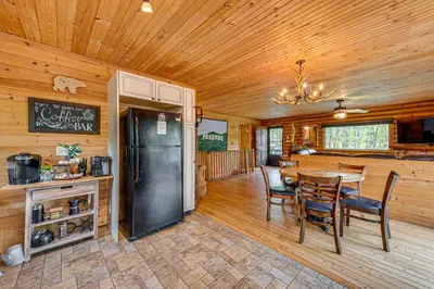 a kitchen and dining room with a table and chairs at Game Room, Hot Tub! Cabin 9 Mi to Big Boulder Mtn in Albrightsville