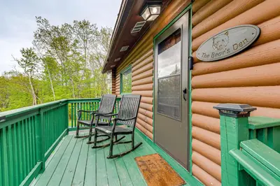 two chairs sitting on the deck of a cabin at Game Room, Hot Tub! Cabin 9 Mi to Big Boulder Mtn in Albrightsville