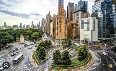 a busy city street with traffic in a city at Apartment near Times Square UWS Manhattan in New York
