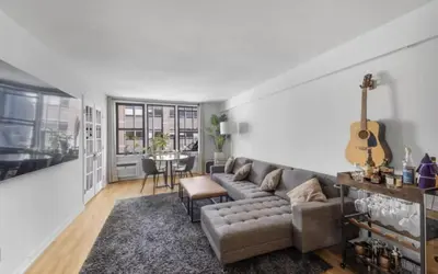 a living room with a couch and a table at Apartment near Times Square UWS Manhattan in New York
