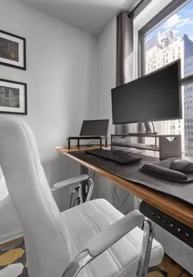 an office with a desk with a computer and a chair at Apartment near Times Square UWS Manhattan in New York