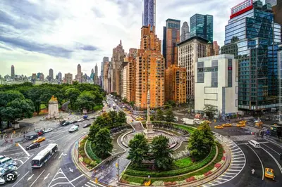 a busy city street with traffic in a city at Private Room with Shared Bathroom at an Apartment by Times Square in New York