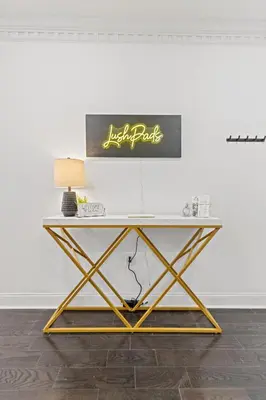 a desk in a room with a white wall at Elegant Urban Retreat in the Heart of Center City in Philadelphia