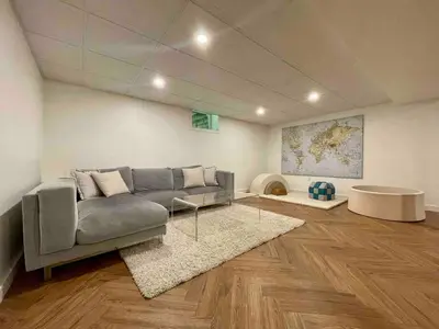 a living room with a couch and a table at Catskills Delaware River Modern Colonial Getaway in Narrowsburg