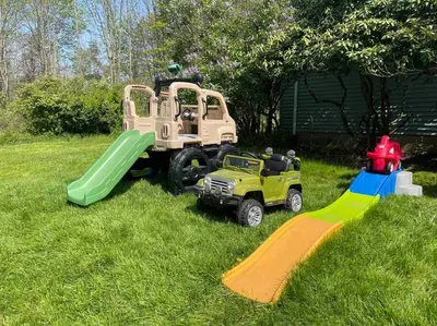 a playground with a toy truck and a slide at Catskills Delaware River Modern Colonial Getaway in Narrowsburg
