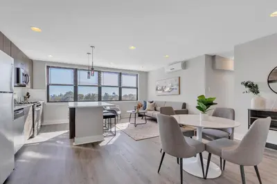 a kitchen and living room with a table and chairs at Avenue B946 City Urban Retreat, 2Br, Free Parking in Philadelphia