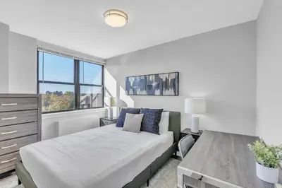 a bedroom with a bed and a window at Avenue B946 City Urban Retreat, 2Br, Free Parking in Philadelphia