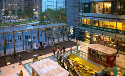 a group of people walking in front of a building at Oasis Room at a Shared Apartment by Times Square in New York