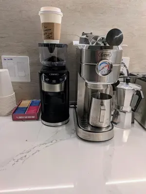 a coffee maker sitting on top of a counter at Oasis Room at a Shared Apartment by Times Square in New York