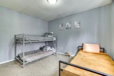 a bedroom with two bunk beds and a bed at Game Room and Pool Access Pocono Paradise Haven in Tobyhanna