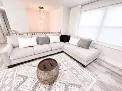 a living room with a couch and a table at Cozy Getaway Lodge & Retreat in Mechanicsburg