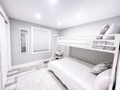 a bedroom with two bunk beds and a window at Cozy Getaway Lodge & Retreat in Mechanicsburg