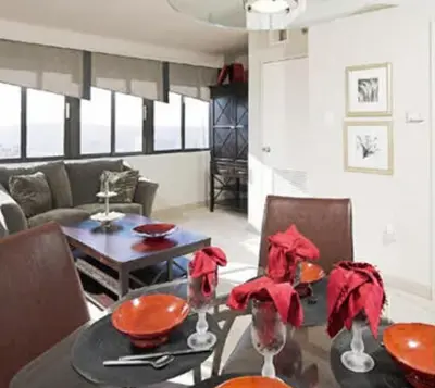 a dining room with a table and a couch at PP 1114 Beautiful Professional 1br Apt, Pool in Harrisburg