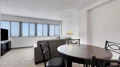 a living room with a table and a couch at PP 1203 Corporate 1br, Pool, Free Parking, Gym in Harrisburg