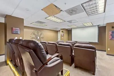 a conference room with brown leather chairs and a whiteboard at PP 1203 Corporate 1br, Pool, Free Parking, Gym in Harrisburg
