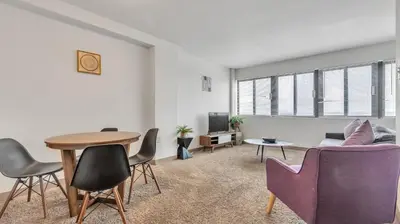 a living room with a table and chairs at PP 1801 Modern Corporate 2br, pool, Gym in Harrisburg
