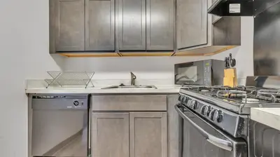 a kitchen with a stove and a sink at PP 1801 Modern Corporate 2br, pool, Gym in Harrisburg