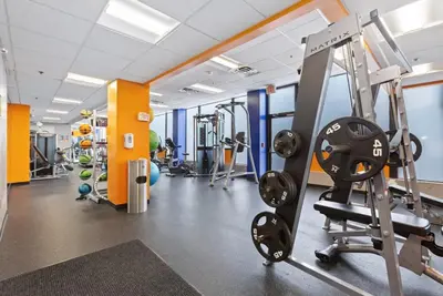 a gym with treadmills and a treadmill at PP 514 City Chic in a Modern Studio Haven in Harrisburg