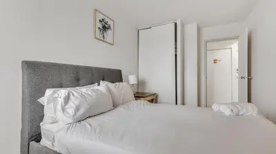 a white bed with white sheets and pillows at PP 2114 Professional 2br apt, Near Hospitals in Harrisburg