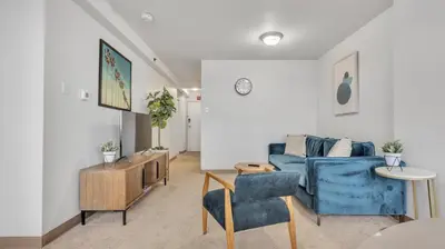 a living room with a blue couch and chairs at PP 2114 Professional 2br apt, Near Hospitals in Harrisburg