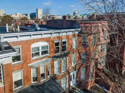 an old brick building with a view of the city at Flats on Front - Riverfront Gem Fast Wi-Fi 3F in Harrisburg
