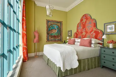 a bedroom with a large bed with a large headboard at Warren Street Hotel in New York