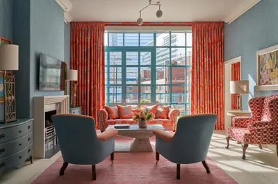 a living room with a couch and chairs and a table at Warren Street Hotel in New York