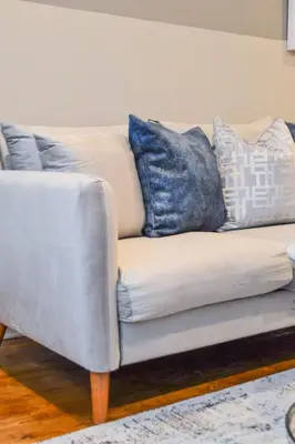 a couch with pillows on it in a living room at Beautiful Irving two bedroom apartment in Philadelphia