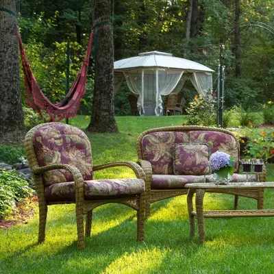 two chairs and a table in the grass at Cherry Valley Manor in Stroudsburg