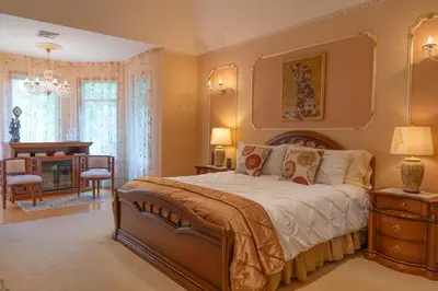 a bedroom with a large bed and a desk at Cherry Valley Manor in Stroudsburg