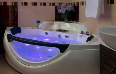 a bath tub in a bathroom with a sink at Cherry Valley Manor in Stroudsburg