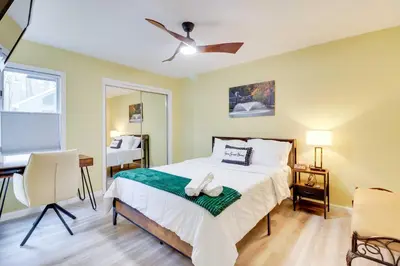 a bedroom with a bed and a desk and a window at Cozy Cabin with Deck Less Than 1 Mi to Jack Frost Resort! in White Haven