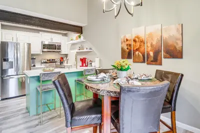 a dining room with a table and chairs in a kitchen at Cozy Cabin with Deck Less Than 1 Mi to Jack Frost Resort! in White Haven