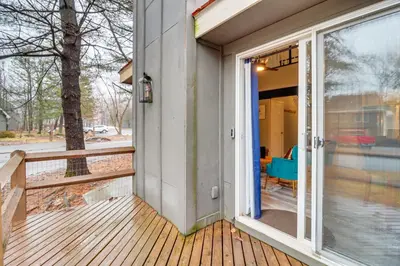 a porch of a house with a sliding glass door at Cozy Cabin with Deck Less Than 1 Mi to Jack Frost Resort! in White Haven